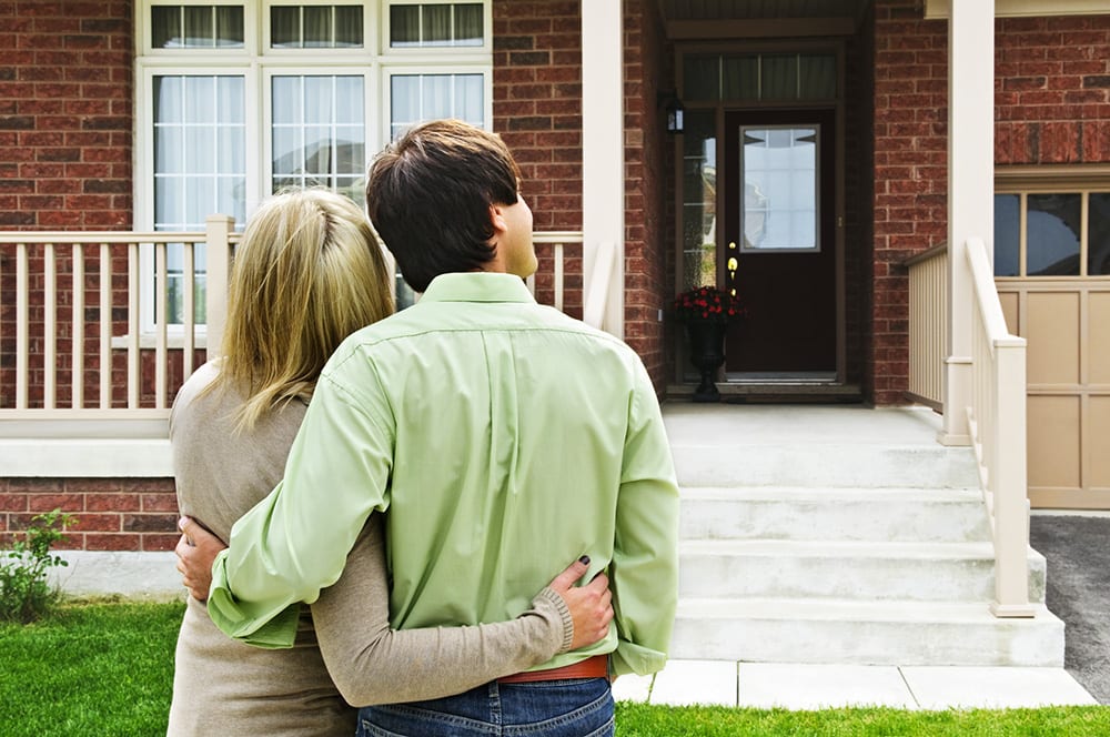 Young happy couple shopping for new home